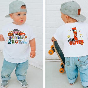 a little boy that is standing up with a skateboard