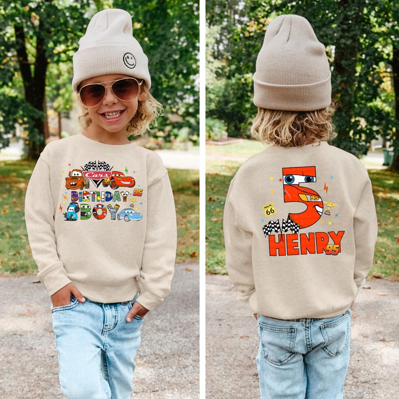 a young boy wearing a sweatshirt with the number five on it