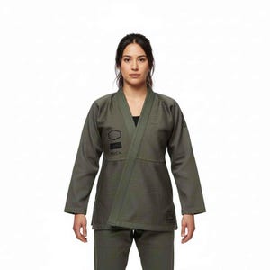 May include: An olive green martial arts uniform, comprising a wrap-style jacket and matching trousers. The jacket has a V-neck design and features black geometric logos and the brand name "RVCA". The uniform is made of a textured fabric.