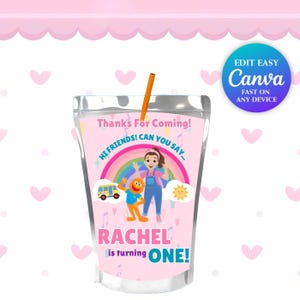 May include: A pink juice pouch with a straw, featuring a rainbow, cartoon characters, and the text "Thanks For Coming!" and "RACHEL is turning ONE!" The design includes a bus, sun, and musical notes. The Canva logo is visible.