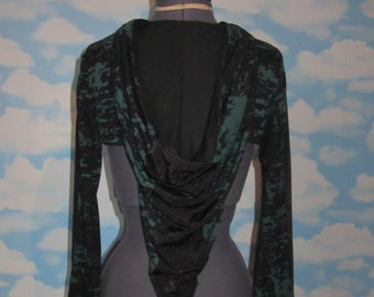 Haussement d'épaules de lutin à capuche en jersey de coton stretch vert et noir. Vendeur britannique