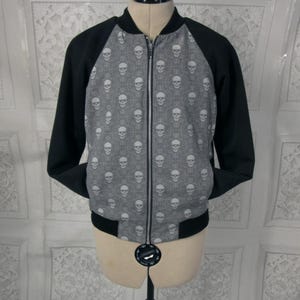 skull bomber jacket with contrast black raglan sleeves.  fully lined in black satin. or custom made