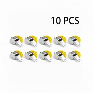 May include: Ten silver whistles with yellow lanyards are arranged on a white background. The text "10 PCS" is displayed above the whistles. The whistles are made of shiny metal and have a classic design.