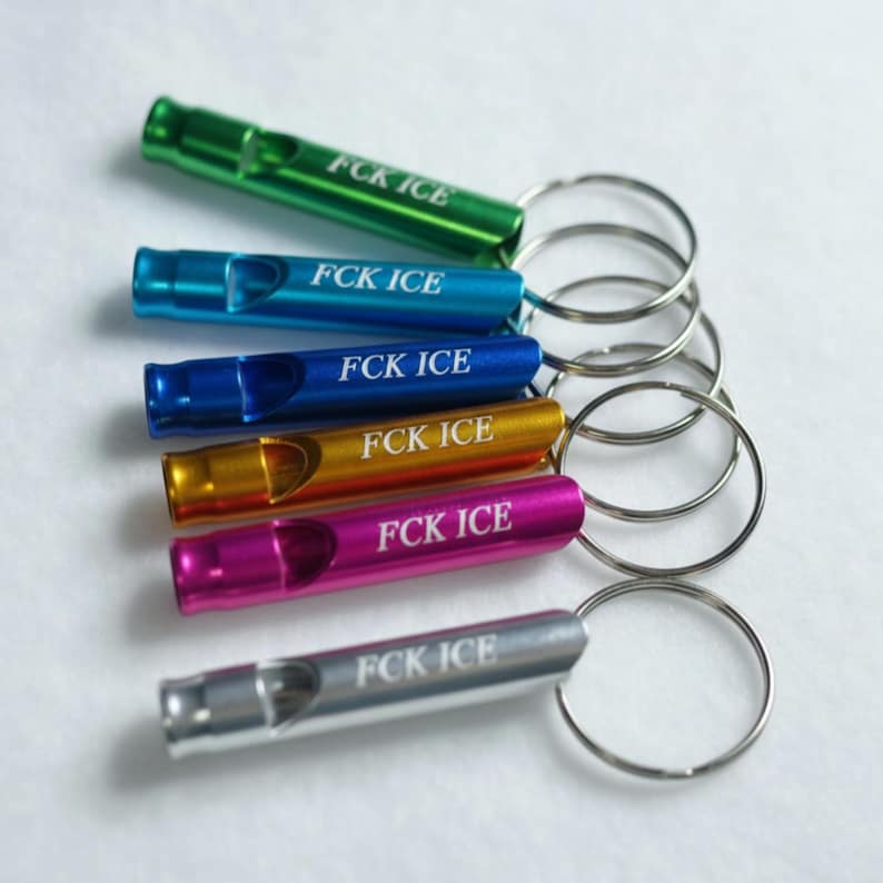 Aluminum Whistle Keychain Protest Tool Activism Accessory Political Statement Piece Emergency Signal Device Multiple Colors Available Compact Size Design Everyday Carry Item Metal Ring Attachment Functional Safety Equipment Loud Sound