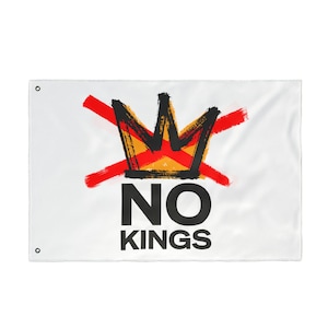 May include: White flag with a black and yellow crown design crossed out by two red brushstrokes. The words "NO KINGS" are printed in black below the crown.