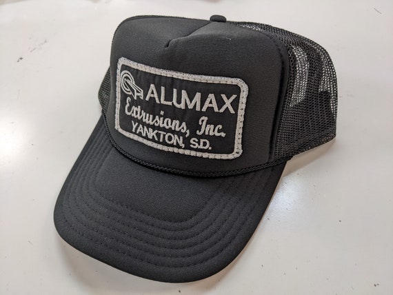 Alumax Patch on Black Trucker Hat