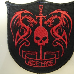 May include: Black embroidered patch with red dragons, a skull, a sword, and the text "RIDE FREE".