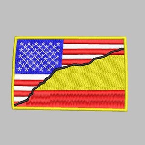 May include: An embroidered patch with a yellow border, featuring a stylized American flag with a black line dividing it from a yellow and red section.