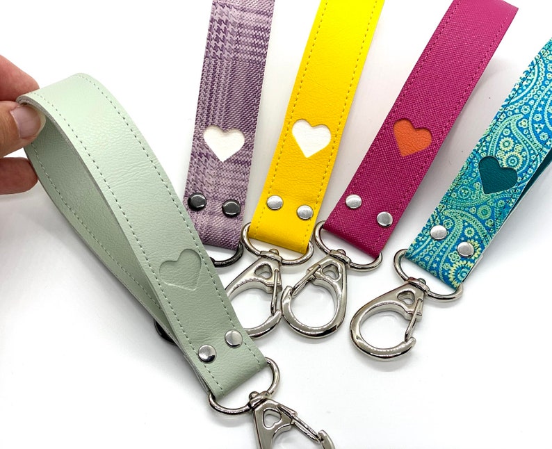 heart embossed key fob wristlet faux leather keychain. you choose from dozens of colors patterns or add your own personalized photo. 