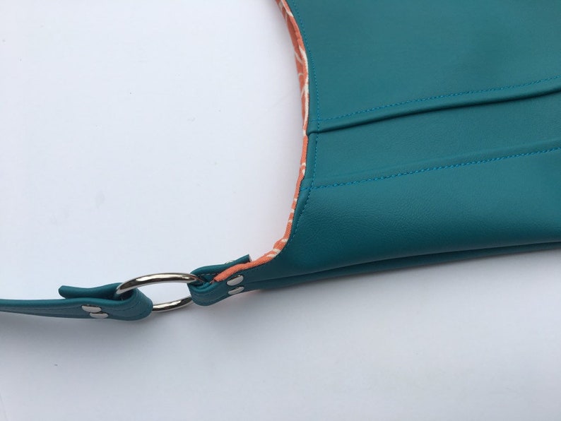 snap closure choose interior color or pattern statement purse turquoise leather vinyl modern diaper bag. tote bag