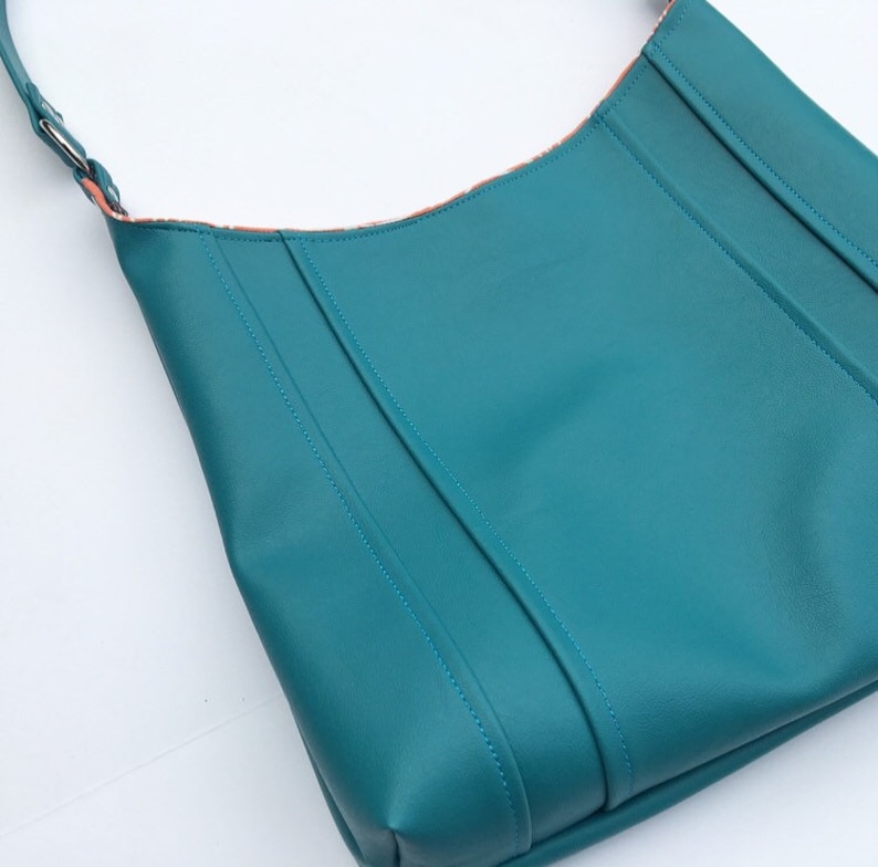snap closure choose interior color or pattern statement purse turquoise leather vinyl modern diaper bag. tote bag