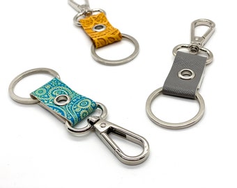 keychain clip and key ring. purse accessory zipper pull. faux leather silver finish.