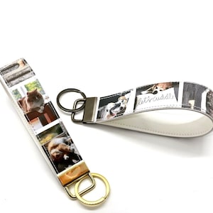 May include: Two keychains with white leather straps and metal rings. One keychain features a white background with a collage of photos of dogs and cats. The other keychain features a white background with a collage of photos of cats. The text "let's cuddle" is printed on the dog keychain.