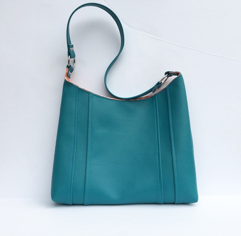 snap closure choose interior color or pattern statement purse turquoise leather vinyl modern diaper bag. tote bag