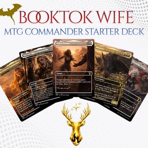 May include: A fan of five Magic: The Gathering trading cards arranged in a semi-circle, featuring fantasy character illustrations and text. Above the cards, the text reads BOOKTOK WIFE MTG COMMANDER STARTER DECK. A gold deer head icon is below.