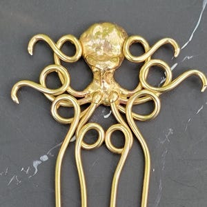 Tenedor de pelo de pulpo en bronce