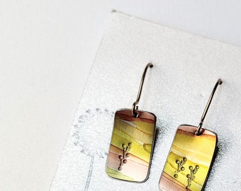 Cute landscape earrings with floral imprint detail. Hand painted anodised aluminium on sterling silver ear wires