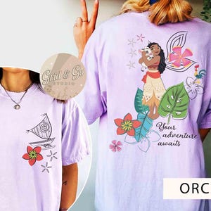 May include: Orchid-colored t-shirts with front and back graphics. The front features a sailboat and flower design. The back displays a cartoon character with a pig, flowers, and the text "Your adventure awaits."