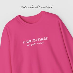 Embroidered 'Hang in there it gets worse' cozy crewneck sweatshirt