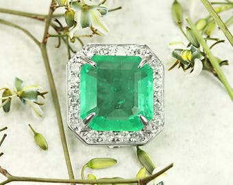 7.98ct Large Colombian emerald and diamond halo in 18K White Gold