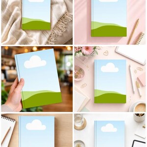 May include: A collection of notebooks with a minimalist design. Each notebook features a light blue cover with a white cloud and green hills. The notebooks are displayed on various surfaces, including a blanket, a pink surface, and a wooden table.