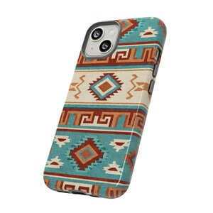 May include: A turquoise and cream phone case with a geometric Southwestern design. The case displays a repeating pattern of diamonds, zigzags, and other shapes in brown and orange hues. The phone case has a camera cutout.