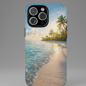 May include: A phone case featuring a tropical beach scene. The image shows a white sandy beach, turquoise water, palm trees, and a bright sun setting over the ocean. The case has a blue border and a black camera module.