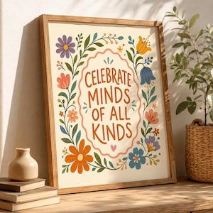 May include: A framed wall art print featuring a cream background with the orange text "CELEBRATE MINDS OF ALL KINDS" inside a scalloped border. The design is surrounded by colorful illustrations of purple, orange, yellow, and blue flowers.