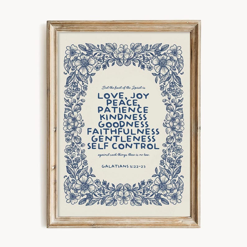 May include: A framed print with a cream background and blue floral border. The text reads "LOVE, JOY, PEACE, PATIENCE, KINDNESS, GOODNESS, FAITHFULNESS, GENTLENESS, SELF CONTROL" from Galatians 5:22-23.