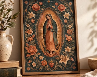 May include: A framed rectangular wall art print featuring the Virgin of Guadalupe centered within a dark teal oval frame, surrounded by a border of orange and pink flowers, golden rays, a crescent moon, and a small winged angel figure.