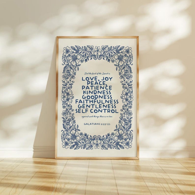 May include: A framed print with a floral border and text. The text reads "LOVE, JOY, PEACE, PATIENCE, KINDNESS, GOODNESS, FAITHFULNESS, GENTLENESS, SELF CONTROL" and "GALATIANS 5:22-23". The print is in a gold frame.