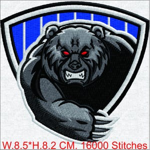 May include: Embroidered patch of a ferocious bear with red eyes and bared teeth. The bear is in shades of grey and black, set against a blue and white shield design. The patch measures 21.6 cm wide by 20.8 cm high.