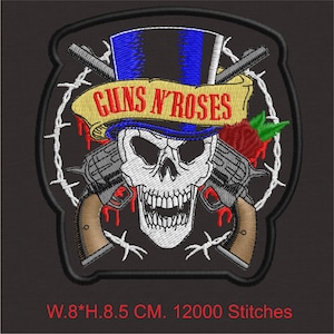 May include: Embroidered patch featuring a skull wearing a blue top hat and a banner with "GUNS N' ROSES" in yellow. Two revolvers are crossed behind the skull, with a red rose and barbed wire accents. The patch measures 8 cm wide and 8.5 cm high.