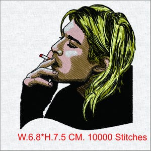 May include: Embroidered portrait of a person smoking a cigarette, with closed eyes. The person has light brown skin and blonde hair, wearing a black shirt. The image is 6.8 cm wide and 7.5 cm high. The embroidery has 10000 stitches.