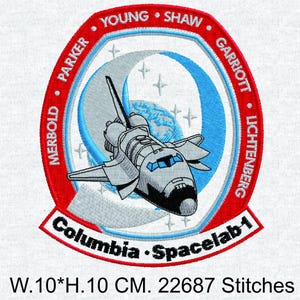 May include: Embroidered patch featuring the Columbia Spacelab-1 space shuttle. The patch is circular, with a red border and the names of the crew members. The shuttle is gray and blue, with the text "Columbia Spacelab-1". The patch is 10 cm wide and 10 cm high.