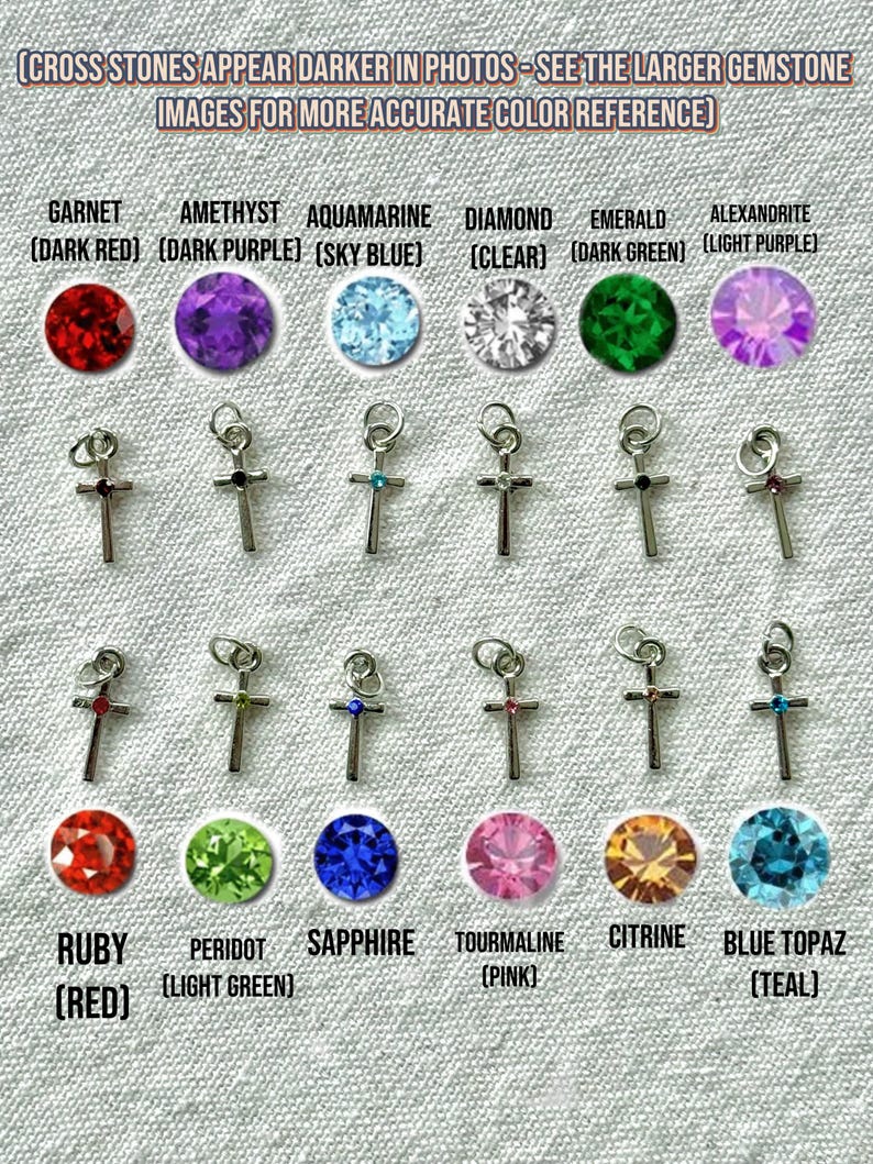 May include: A collection of silver cross pendants with various gemstone accents, including garnet, amethyst, aquamarine, diamond, emerald, alexandrite, ruby, peridot, sapphire, tourmaline, citrine, and blue topaz. Text at the top reads: "CROSS STONES APPEAR DARKER IN PHOTOS - SEE THE LARGER GEMSTONE IMAGES FOR MORE ACCURATE COLOR REFERENCE".