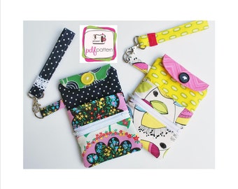 Puede incluir: Dos bolsas con cremallera de colores con correas de muñeca. Una bolsa tiene una tela de lunares negros y blancos con un estampado floral y la otra tiene una tela amarilla y blanca con un estampado floral rosa y blanco. Las bolsas están etiquetadas con "pdfpattern".