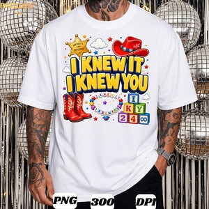 May include: A white t-shirt featuring a graphic print with the text I KNEW IT I KNEW YOU in yellow, a gold sheriff star, a red cowboy hat, red cowboy boots, a colorful beaded necklace, and stacked alphabet and number blocks in primary colors.