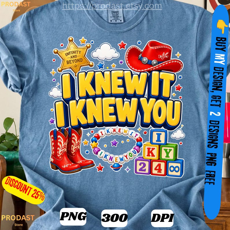 May include: A heather blue t-shirt featuring a graphic with a gold sheriff star, a red cowboy hat, and red cowboy boots. The text reads I KNEW IT I KNEW YOU. It includes a circular bead necklace and a stack of colorful alphabet blocks with letters.