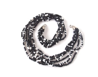 Vintage Black and White Beaded Necklace Six Strands of Diagonally Cut Glass Beads of White and Black Interspersed in Lovely Hanging Necklace
