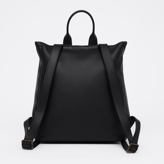 black leather sleek backpack Microfiber but its functionality goes even further with enough pockets to carry work essentials Sloan Mini Leather Backpack -