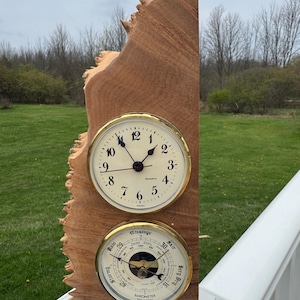 May include: A wooden clock and barometer combination. The clock has a white face with black numerals and hands, and the barometer has a gauge with a needle. The wood has a natural, rough edge.