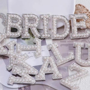 “Set of pearl and rhinestone chenille letter patches for personalized gifts and bags, including letters A to Z and BRIDE design.”