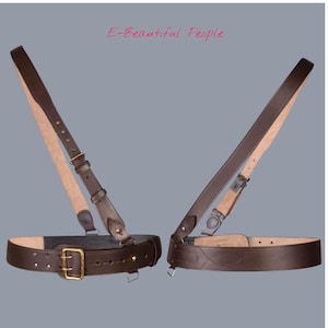 May include: Two brown leather belts with suspender straps. The belts feature gold-coloured buckles and are connected to the suspender straps with metal hardware. The text "E-Beautiful People" is visible.