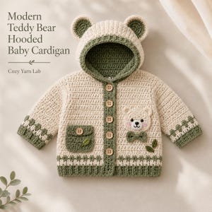 May include: A cream and sage green crocheted baby cardigan with a hood featuring bear ears. The garment has five wooden buttons, a pocket with a leaf detail, and a bear face appliqué with a bow tie. Text reads: Modern Teddy Bear Hooded Baby Cardigan.