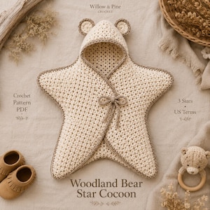 May include: A cream-colored crochet star-shaped cocoon with a hood featuring small bear ears and a brown trim. The text reads Willow & Pine Crochet, Crochet Pattern PDF, 3 Sizes US Terms, and Woodland Bear Star Cocoon.