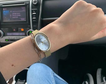 Reloj de pulsera dorado para mujer / Correa minimalista ovalada de acero inoxidable
