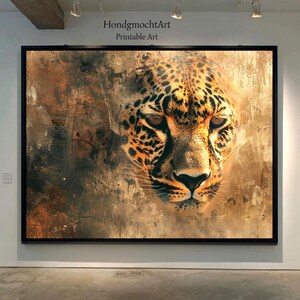 May include: A framed print featuring a close-up of a leopard's face. The artwork has a textured, abstract background with warm brown and gold tones. The leopard's fur is detailed with black spots and orange hues. The text "HondgmochtArt Printable Art" is at the top.
