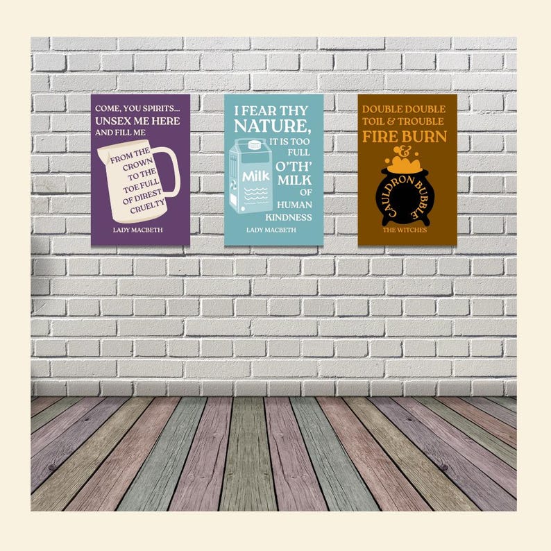 May include: Three framed art prints with quotes from Shakespeare's Macbeth. The prints are on a white brick wall above a wooden floor. The prints are purple, blue, and brown with white and gold text. The quotes are from Lady Macbeth and the witches.