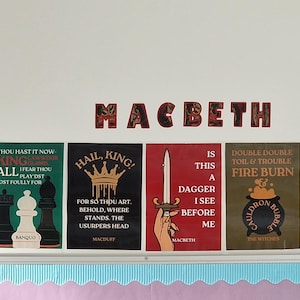 May include: A collection of colorful posters with quotes from Shakespeare's Macbeth, displayed on a white wall. The word "Macbeth" is spelled out in decorative letters above the posters. Each poster features unique designs and text, with a variety of colors.